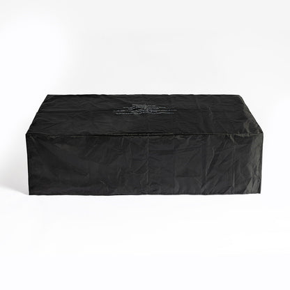 Rectangular fire pit table under black protective cover on Tampa Home & Garden Store