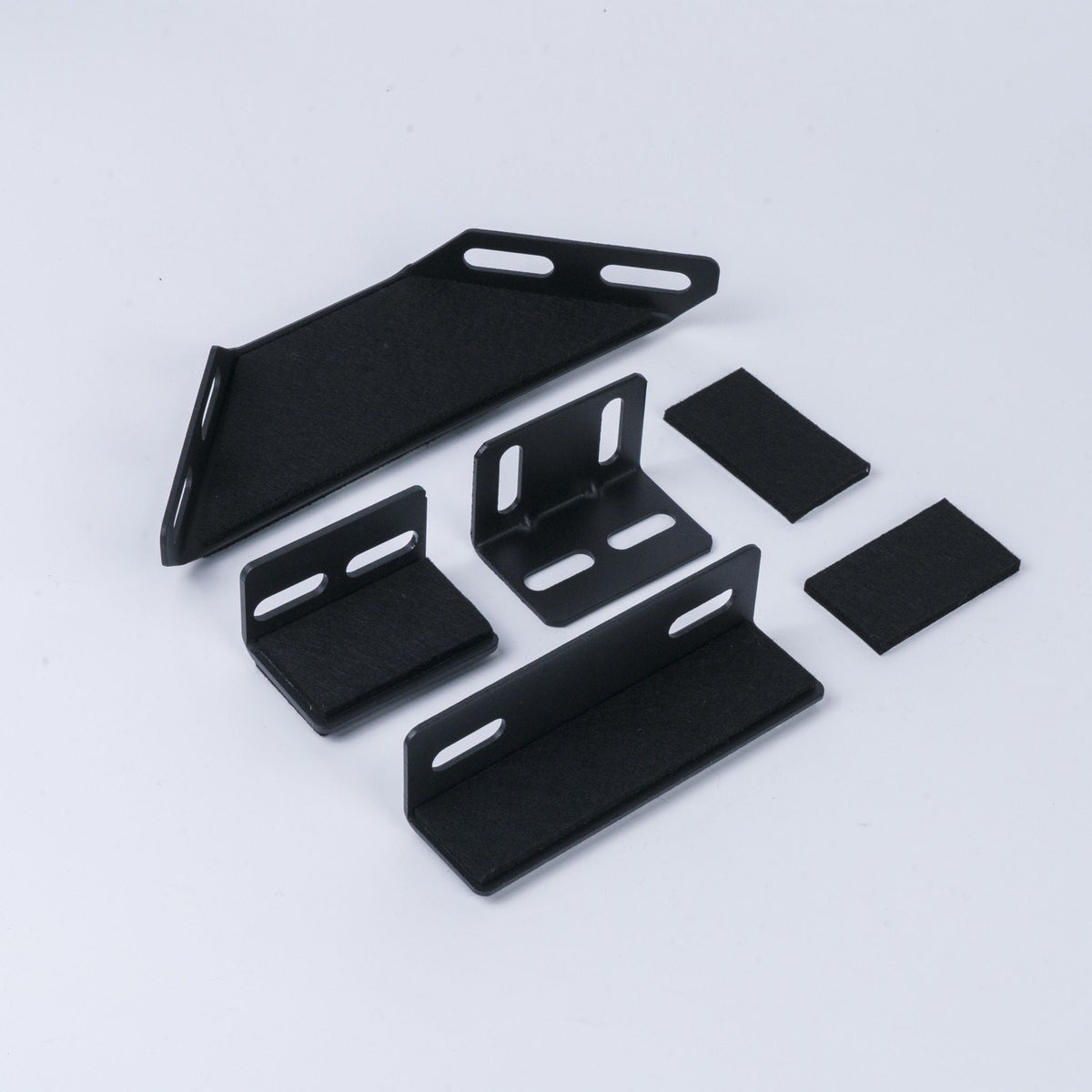 Upholstered platform bed components in black metal with slotted brackets; multi-piece set on Tampa Home & Garden Store