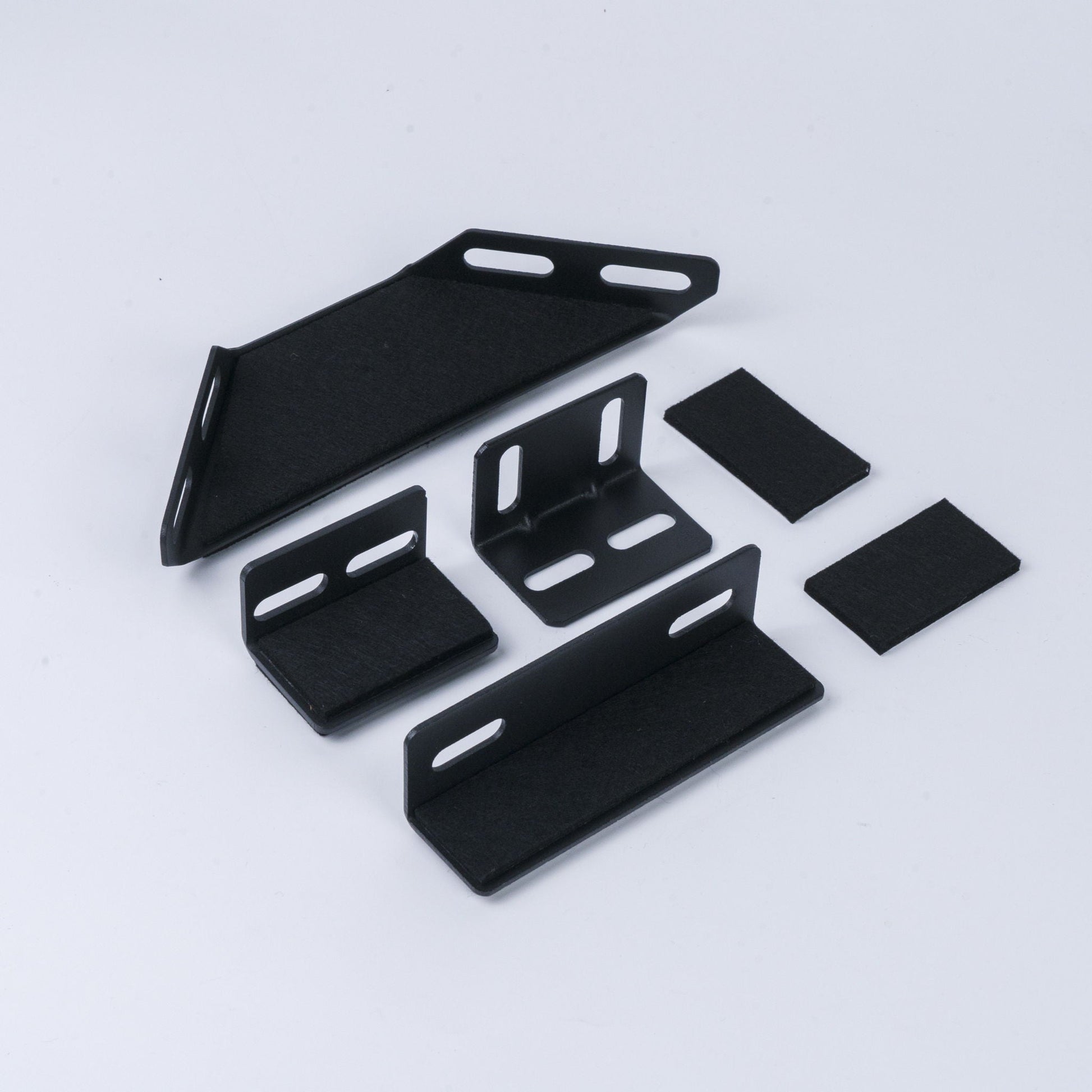 Upholstered platform bed components in black metal with slotted brackets; multi-piece set on Tampa Home & Garden Store