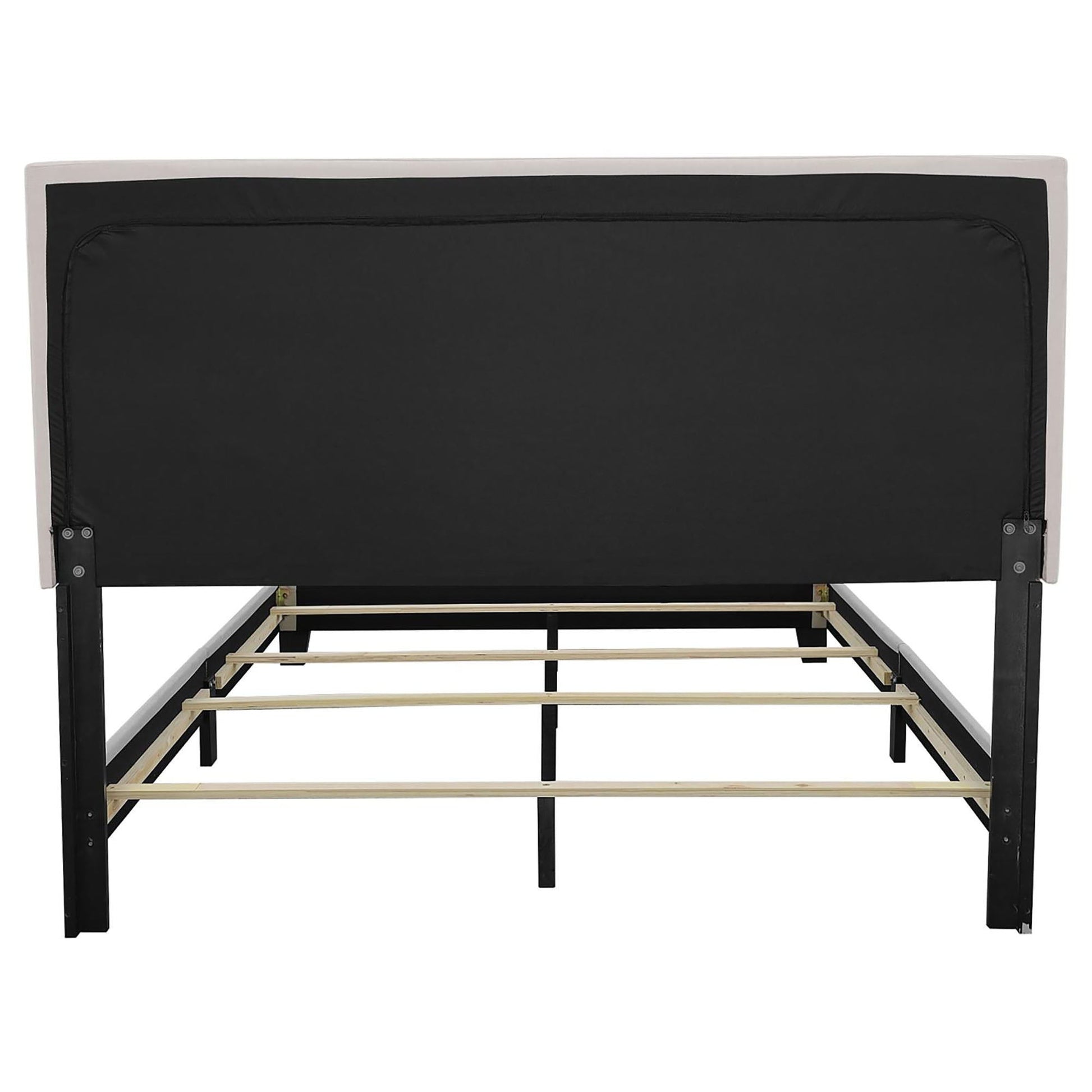 Ivory bed with nailhead trim, black upholstered headboard panel, platform bed frame on Tampa Home & Garden Store