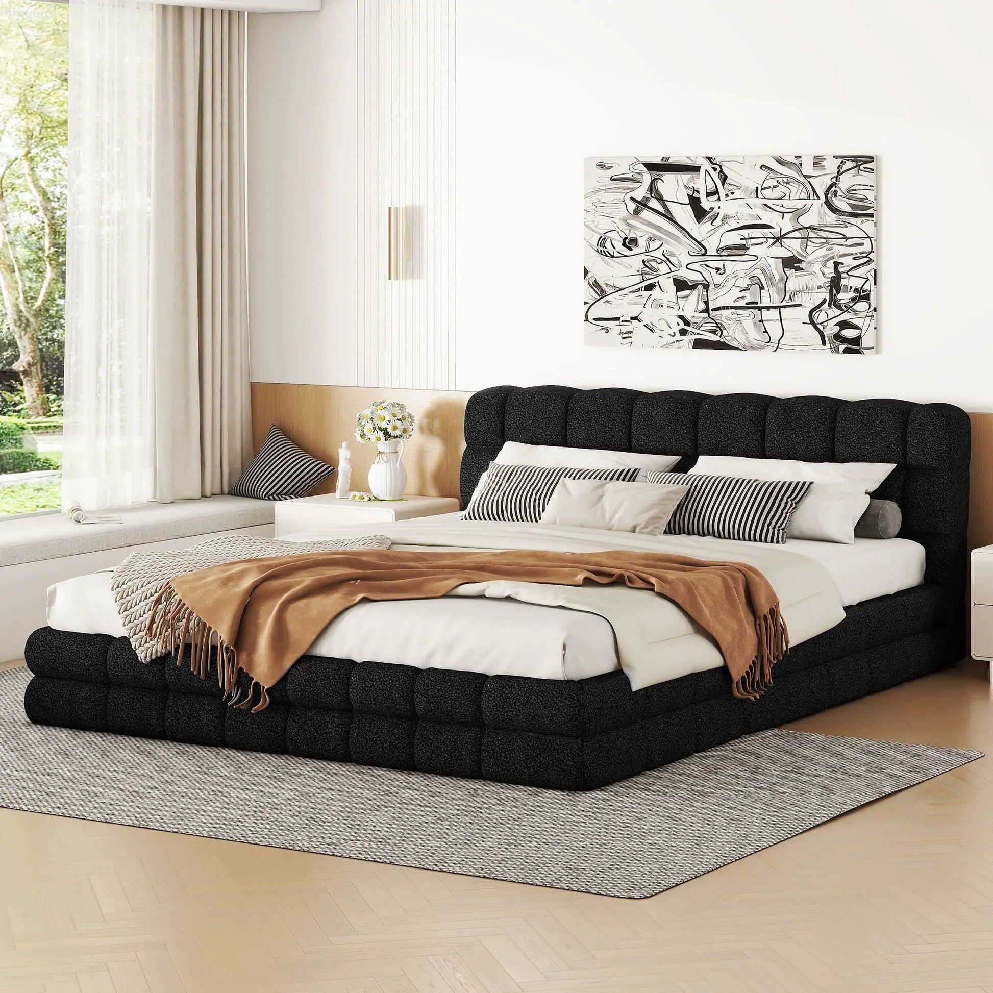Upholstered platform bed with black tufted headboard and white bedding in a modern bedroom on Tampa Home & Garden Store