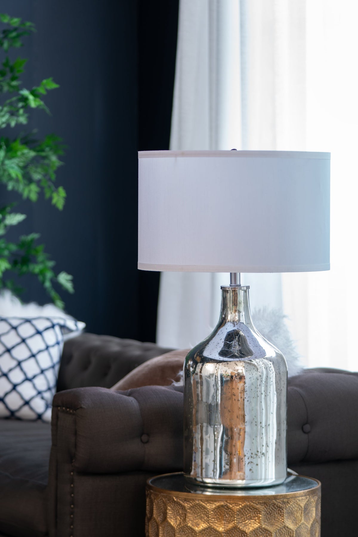 Silver round table lamp by HouseOfZazla with white fabric shade and hammered metal base on Tampa Home & Garden Store