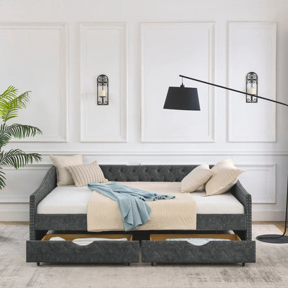 Gray upholstered tufted daybed with 2 drawers and waved arms, beige quilt and blue throw on Tampa Home & Garden Store