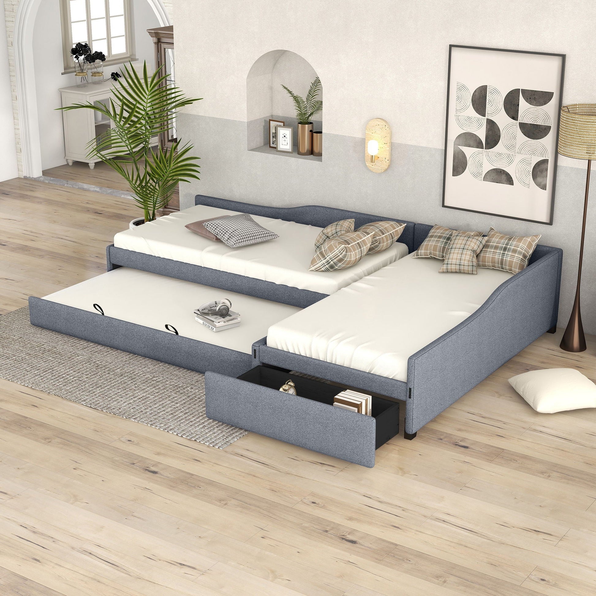 Upholstered double daybed with trundle and drawer in gray fabric, three daybeds shown on Tampa Home & Garden Store