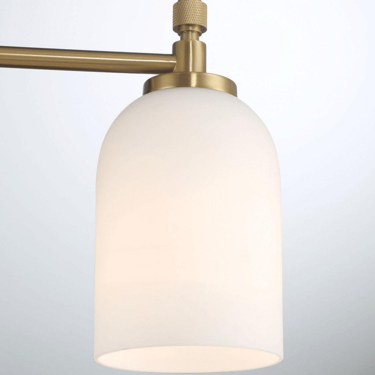 3-light vanity wall light with frosted glass shades and brass finish on Tampa Home & Garden Store