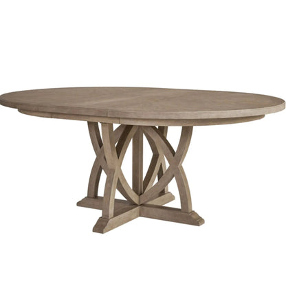 Round extendable dining table sand finish with crisscross pedestal base on Tampa Home & Garden Store
