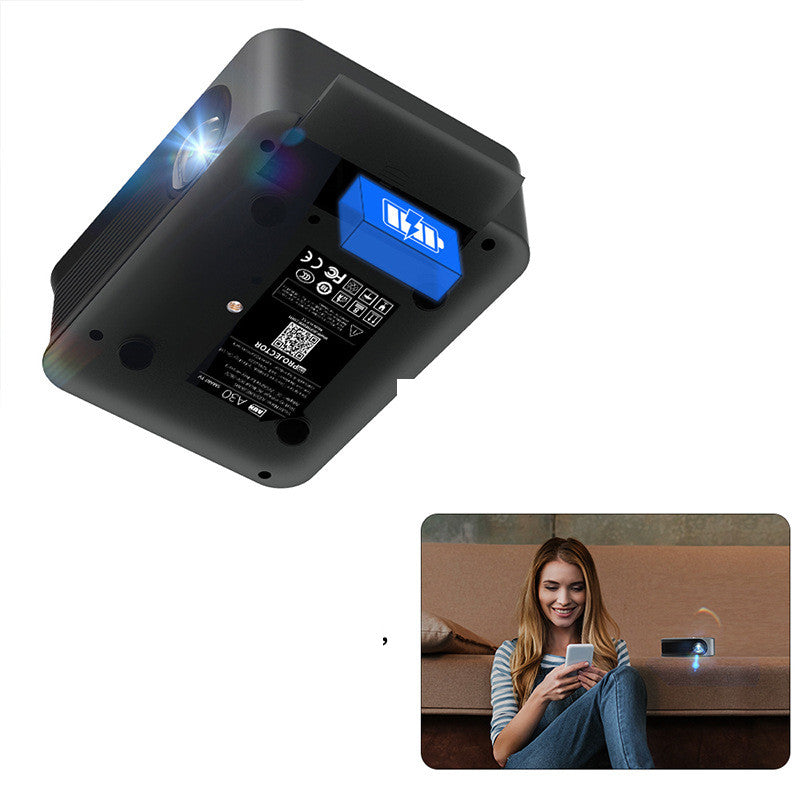 Portable wireless HD compact projector; black body with blue battery module; living room projection on Tampa Home & Garden Store