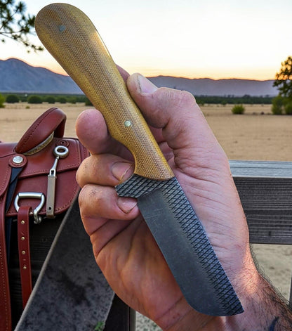 The Ironhorse bull cutter knife with brown Micarta handle and leather sheath on Tampa Home & Garden Store