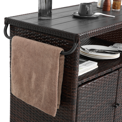 Outdoor wicker bar cart with glass top in light brown, wheels and lower shelf with plates on Tampa Home & Garden Store