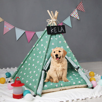 Pet tent kennel mint green teepee with white triangles, dog inside, bunting backdrop on Tampa Home & Garden Store