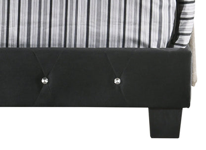 Luxurious Upholstered Bed with black tufted headboard and crystal buttons, striped gray bedding on Tampa Home & Garden Store
