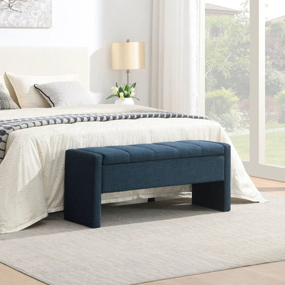 Modern upholstered bed end bench with storage in navy fabric at foot of bed with bedding on Tampa Home & Garden Store