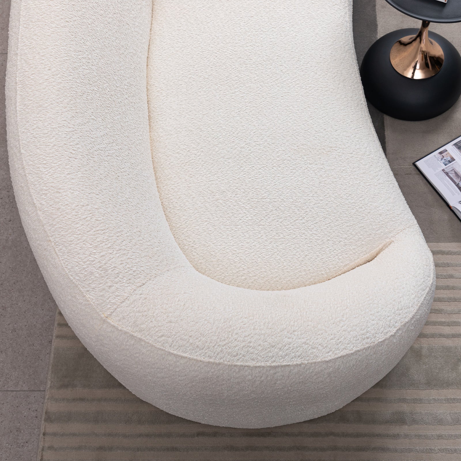 Minimalist curved 3-seater sofa in cream boucle fabric on Tampa Home & Garden Store