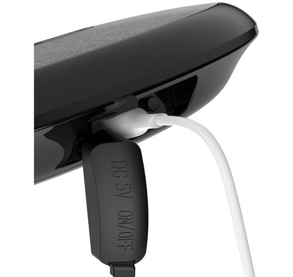 Waterproof Bluetooth speaker black with white charging cable plugged in My Store on Tampa Home & Garden Store