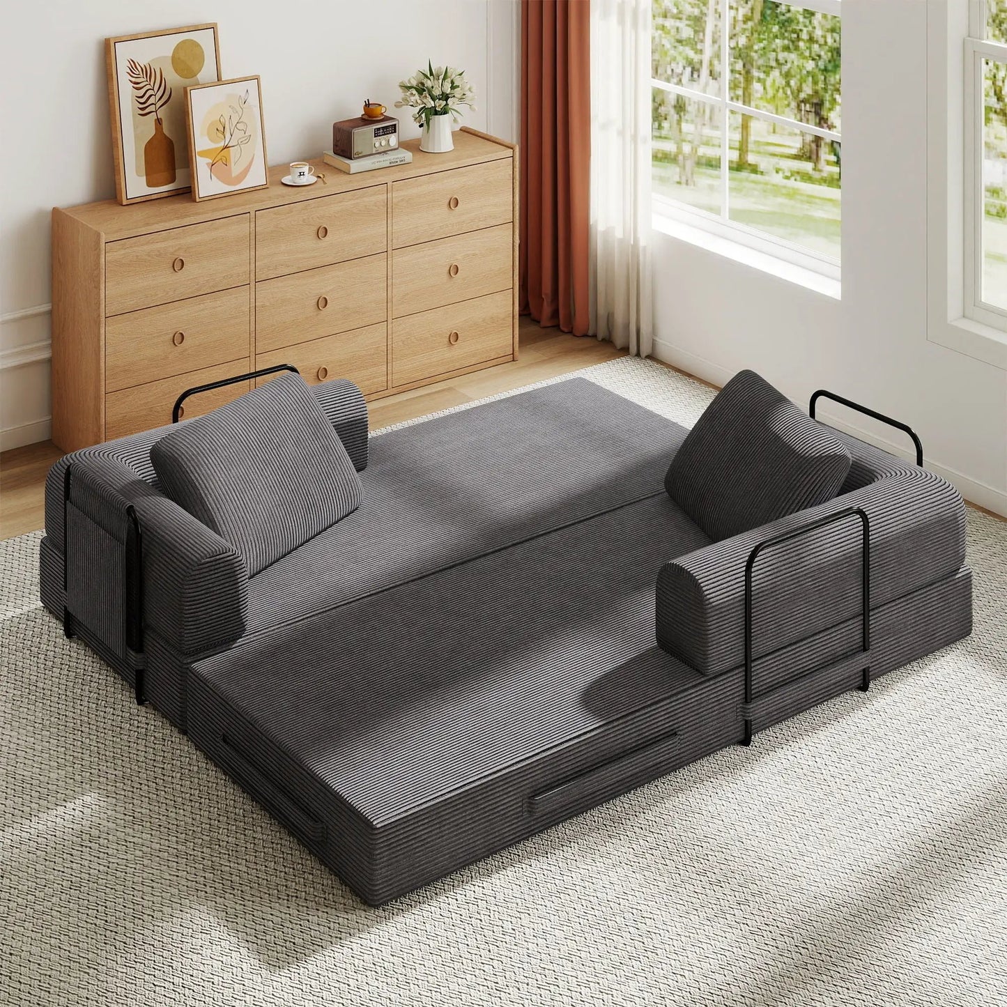 Two modular convertible sleeper sofas with cylindrical pillows in dark gray striped upholstery on Tampa Home & Garden Store