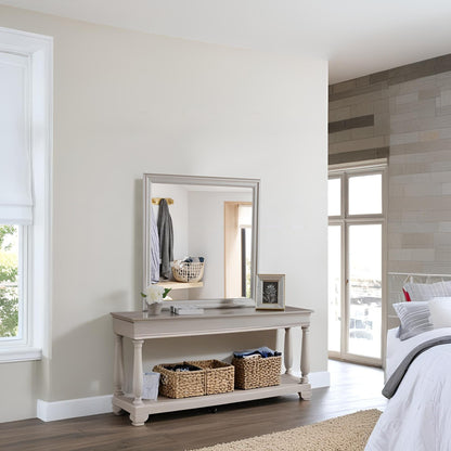 Traditional wall mirror with light wood veneer frame above a beige console table on Tampa Home & Garden Store