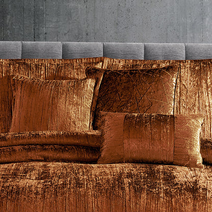 Turin 7 Piece Spice Crinkle Velvet Comforter Set on bed with copper velvet pillows on Tampa Home & Garden Store