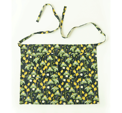 Gardener's Half Apron by Womanswork, dark navy floral with green leaves and yellow flowers on Tampa Home & Garden Store