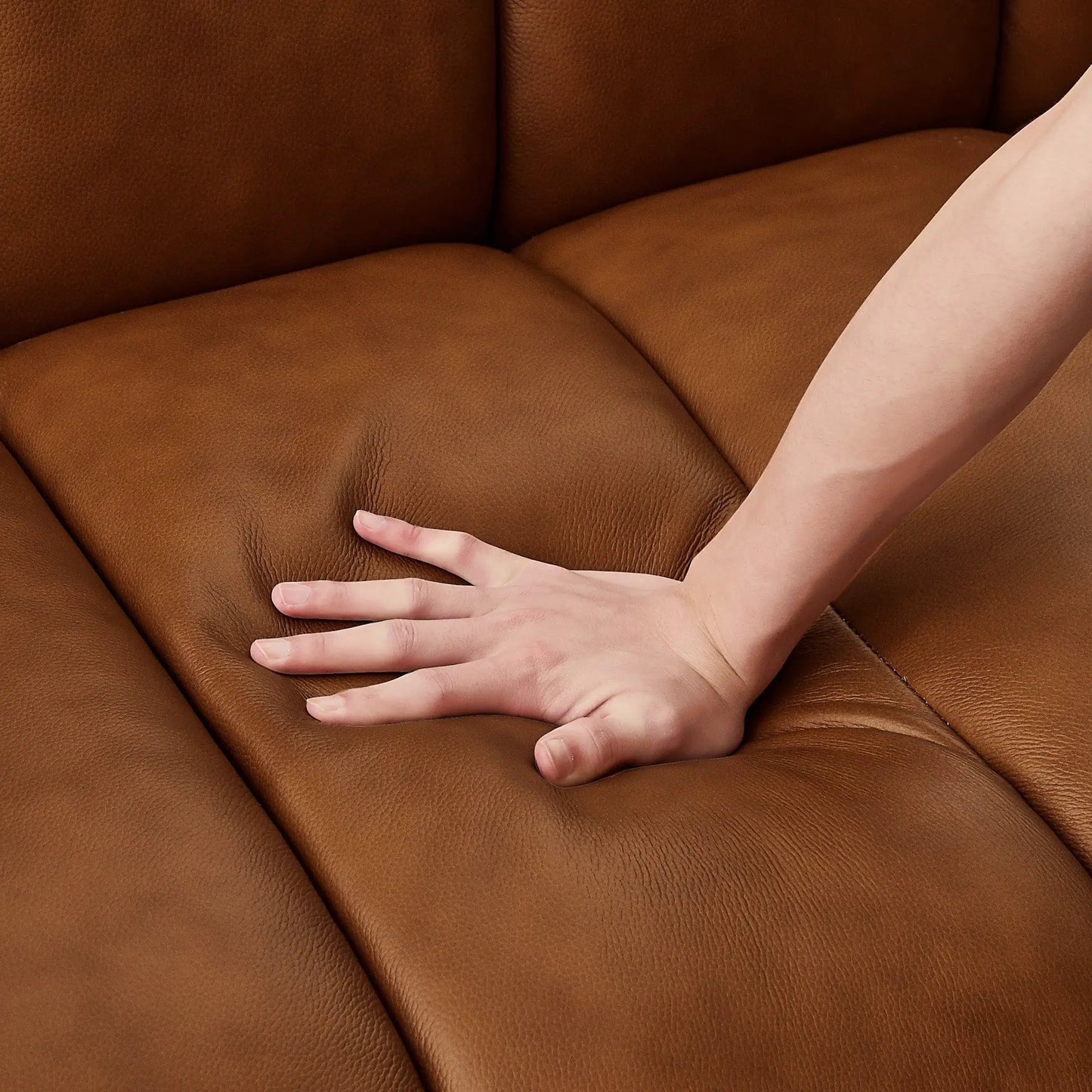 Jasmin upholstered sofa in rich brown leather with visible grain and seam detail on Tampa Home & Garden Store