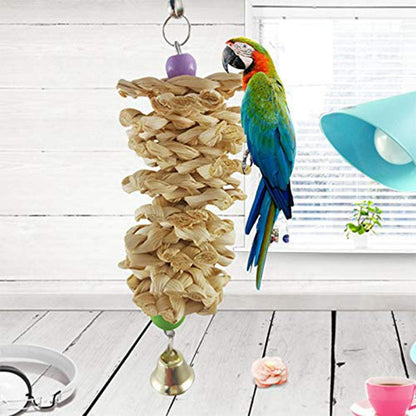 Parrot toy with bell and natural wooden grass bite hanging cage, colorful macaw perched beside on Tampa Home & Garden Store