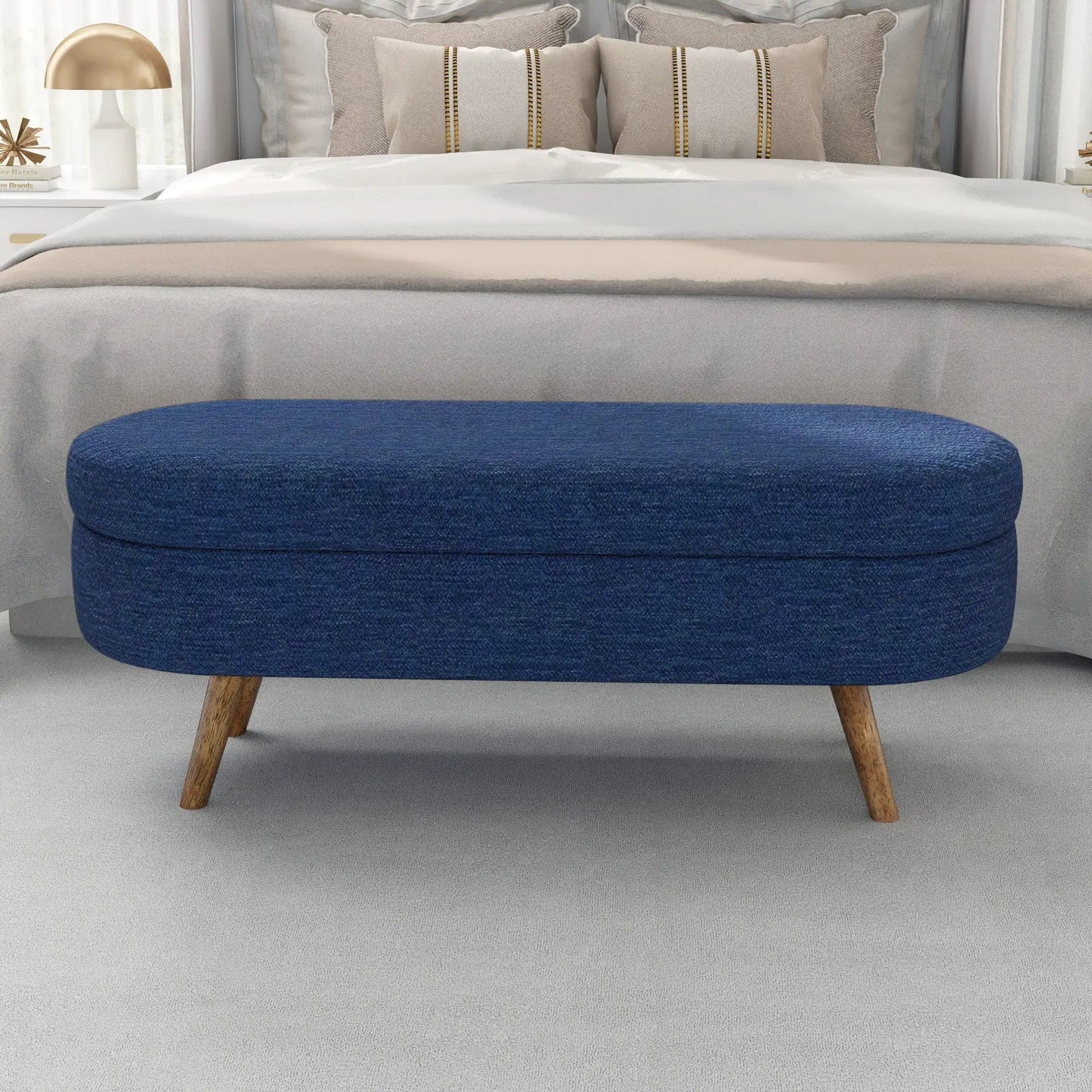 Ottoman oval storage bench in blue fabric with rubber wood legs on Tampa Home & Garden Store