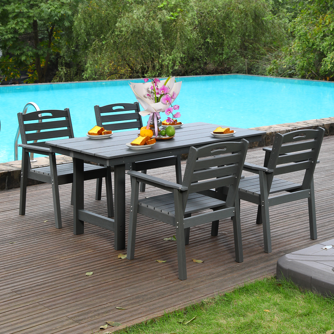 HDPE outdoor patio dining set with table and four dark gray chairs on a wood deck beside a pool on Tampa Home & Garden Store