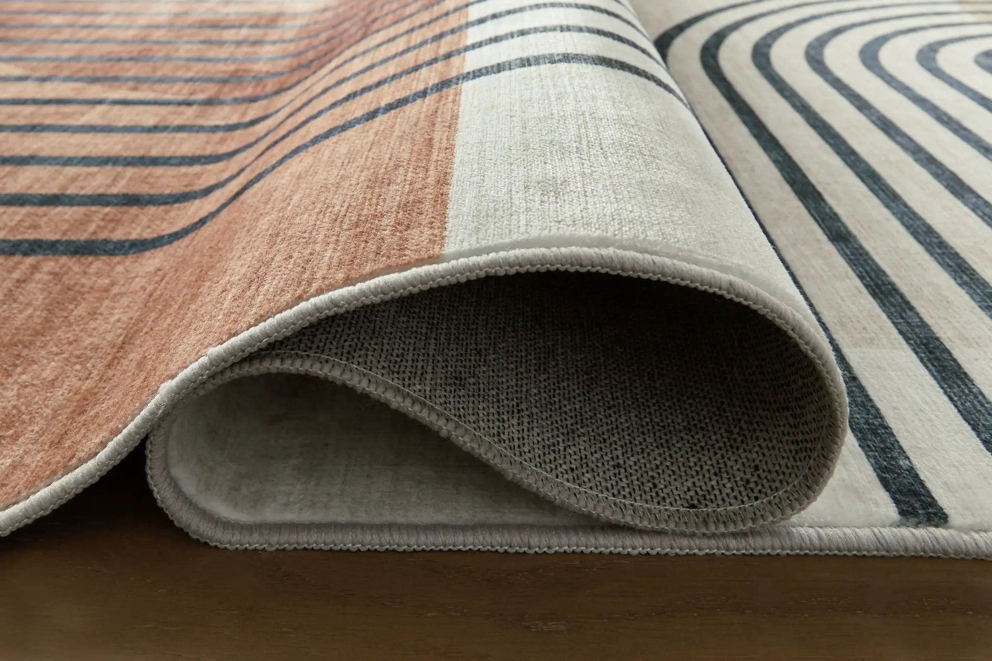 Farrendale washable rug by Unique Piece Furniture, orange cream navy stripes, soft pile on Tampa Home & Garden Store