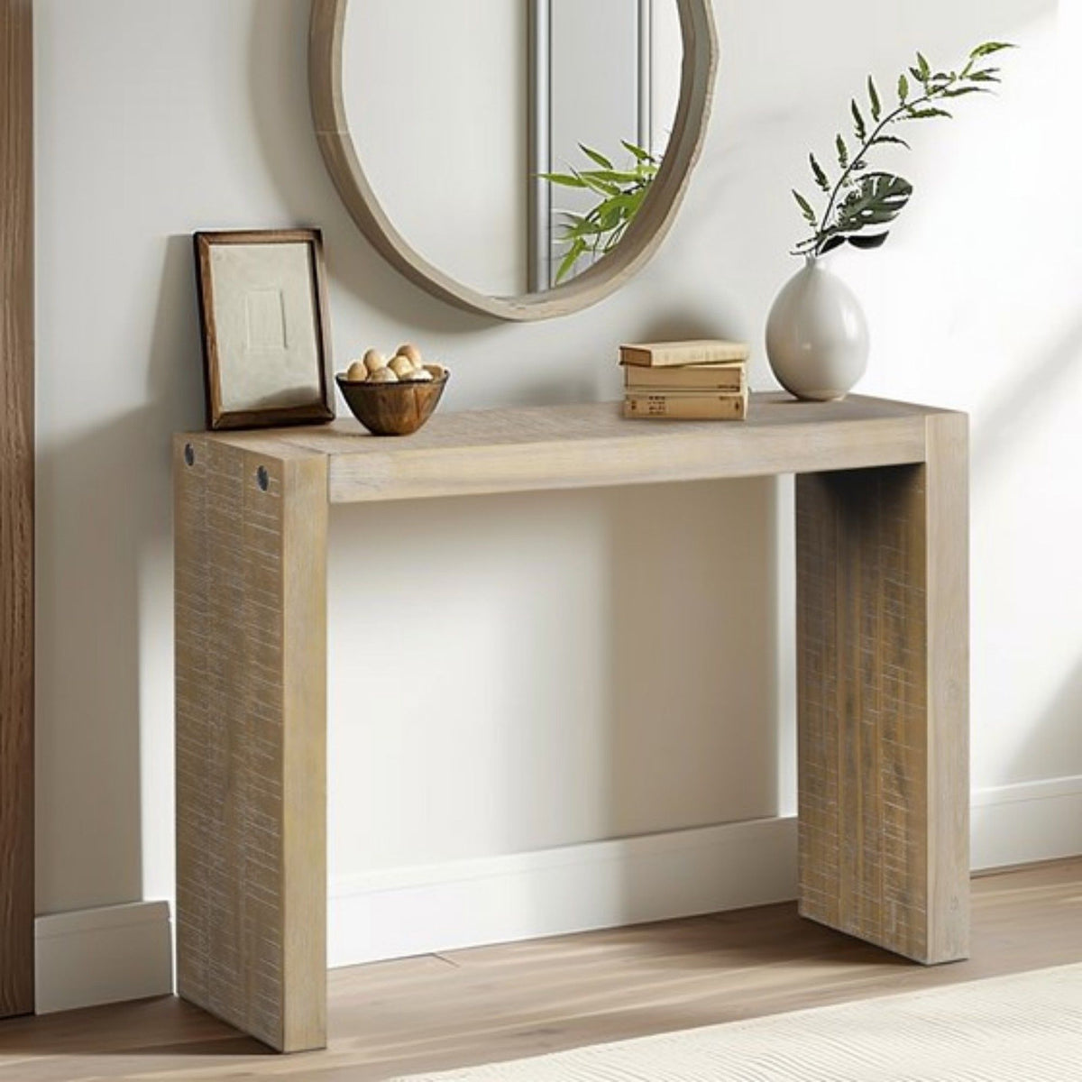 Console table in light brown solid wood by HouseOfZazla under a round wall mirror on Tampa Home & Garden Store
