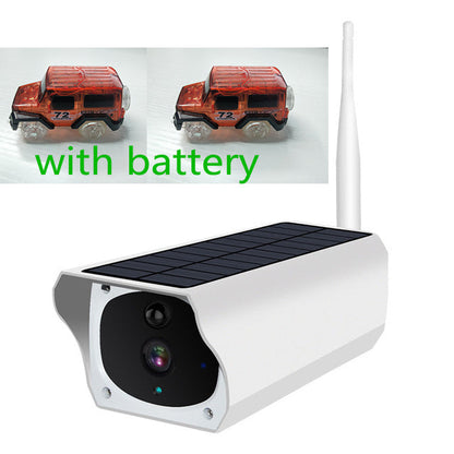 Solar surveillance camera Sell My Stuff, white housing; two red toy cars on Tampa Home & Garden Store