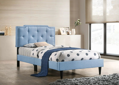Blue upholstered bed with button-tufted headboard and matching frame in a modern room on Tampa Home & Garden Store