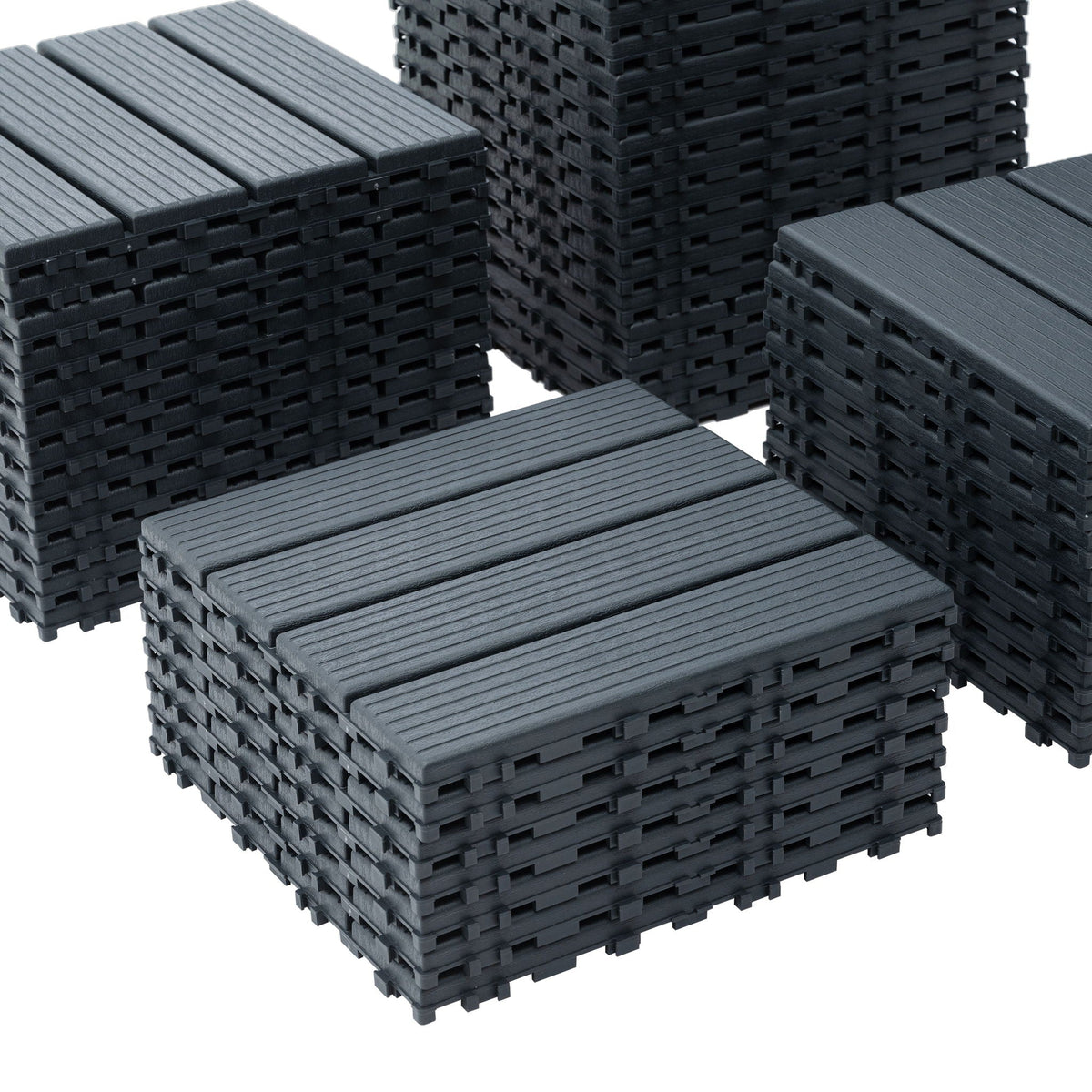 Dark gray interlocking deck tiles with ribbed surface no-tool assembly stacked on Tampa Home & Garden Store