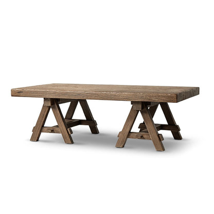 Trestle coffee table in solid reclaimed elm with natural brown finish and sawhorse-style legs on Tampa Home & Garden Store