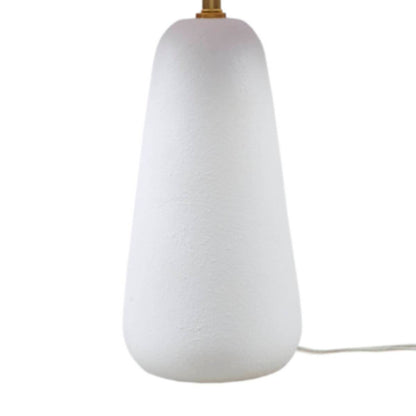 Table lamp with textured white ceramic base; cord visible on Tampa Home & Garden Store