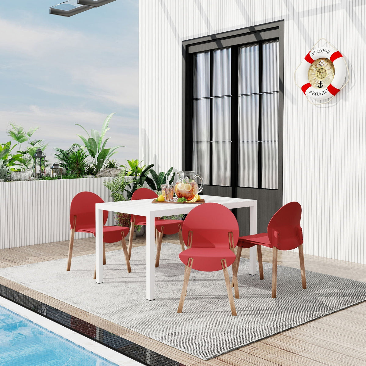4 Piece Outdoor Set with Ergonomic Polypropylene Chairs in red around a white table by pool on Tampa Home & Garden Store