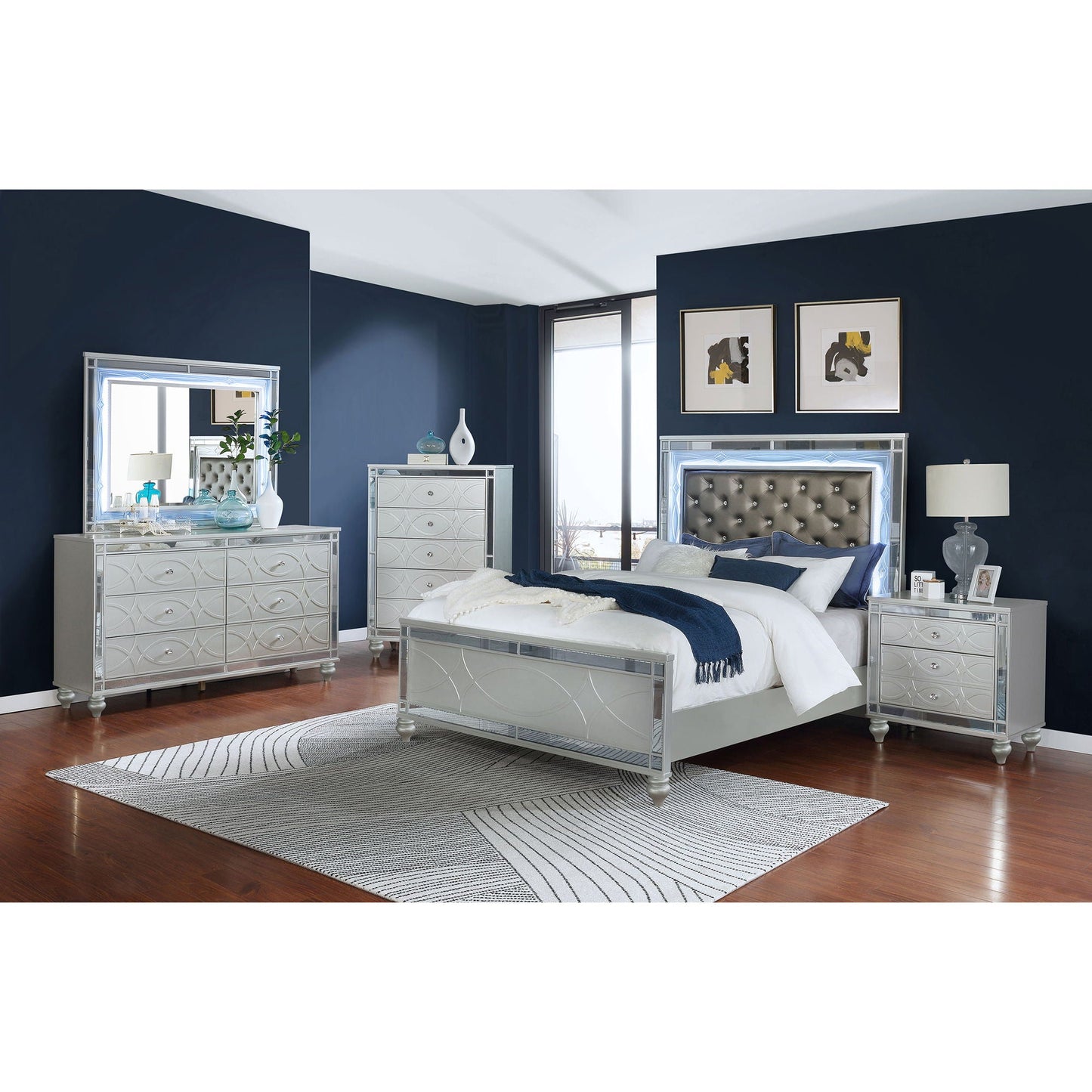 Karmen Panel Bed silver mirrored with tufted gray headboard in a navy blue bedroom on Tampa Home & Garden Store