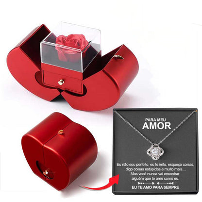 Red apple-shaped jewelry box with clear lid holding a rose, and a black necklace gift box on Tampa Home & Garden Store