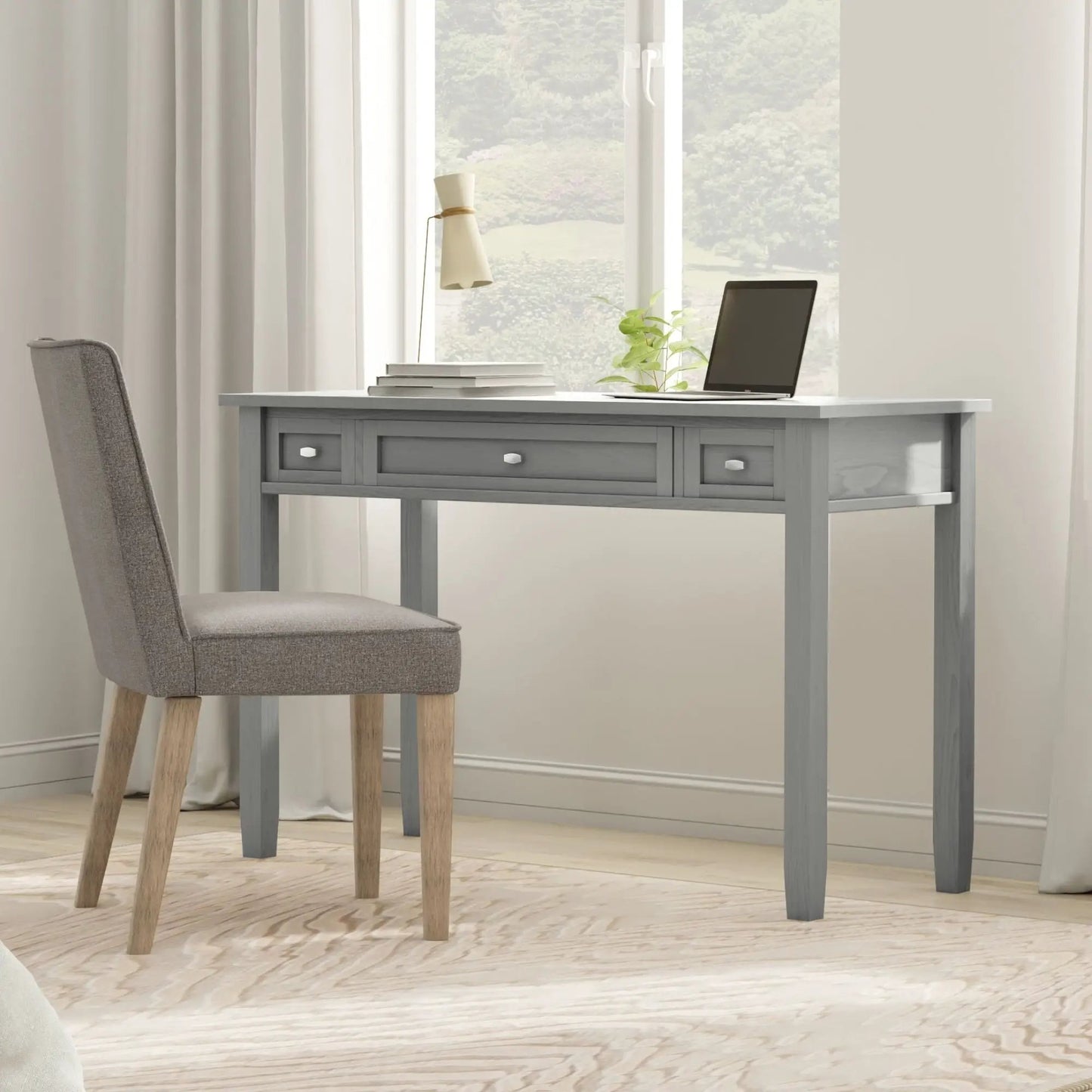 Warm Shaker Handcrafted Desk in warm gray-blue finish with laptop and stacked books on Tampa Home & Garden Store