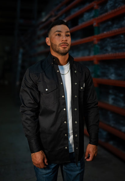 FR Western Style Pearl Snap Black shirt by Static FR worn by man in a warehouse on Tampa Home & Garden Store
