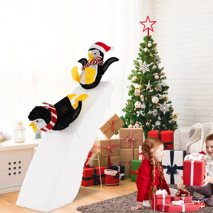 4-ft DirectDeals penguin ice skating lawn decor on snowy slide with scarf and yellow feet on Tampa Home & Garden Store
