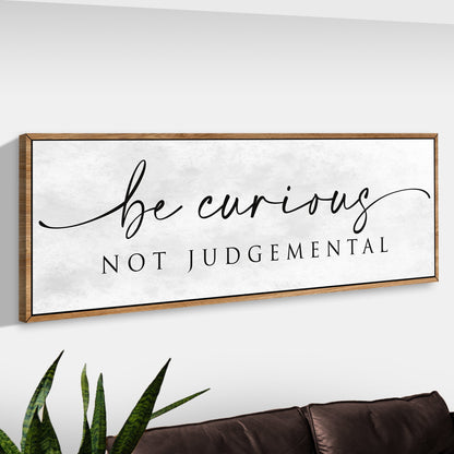 Canvas sign Be Curious Not Judgemental in black script with natural wood frame on Tampa Home & Garden Store
