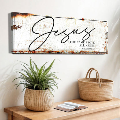 Jesus The Name Above All Names Faith Sign II canvas wall art with a rust border above a plant on Tampa Home & Garden Store