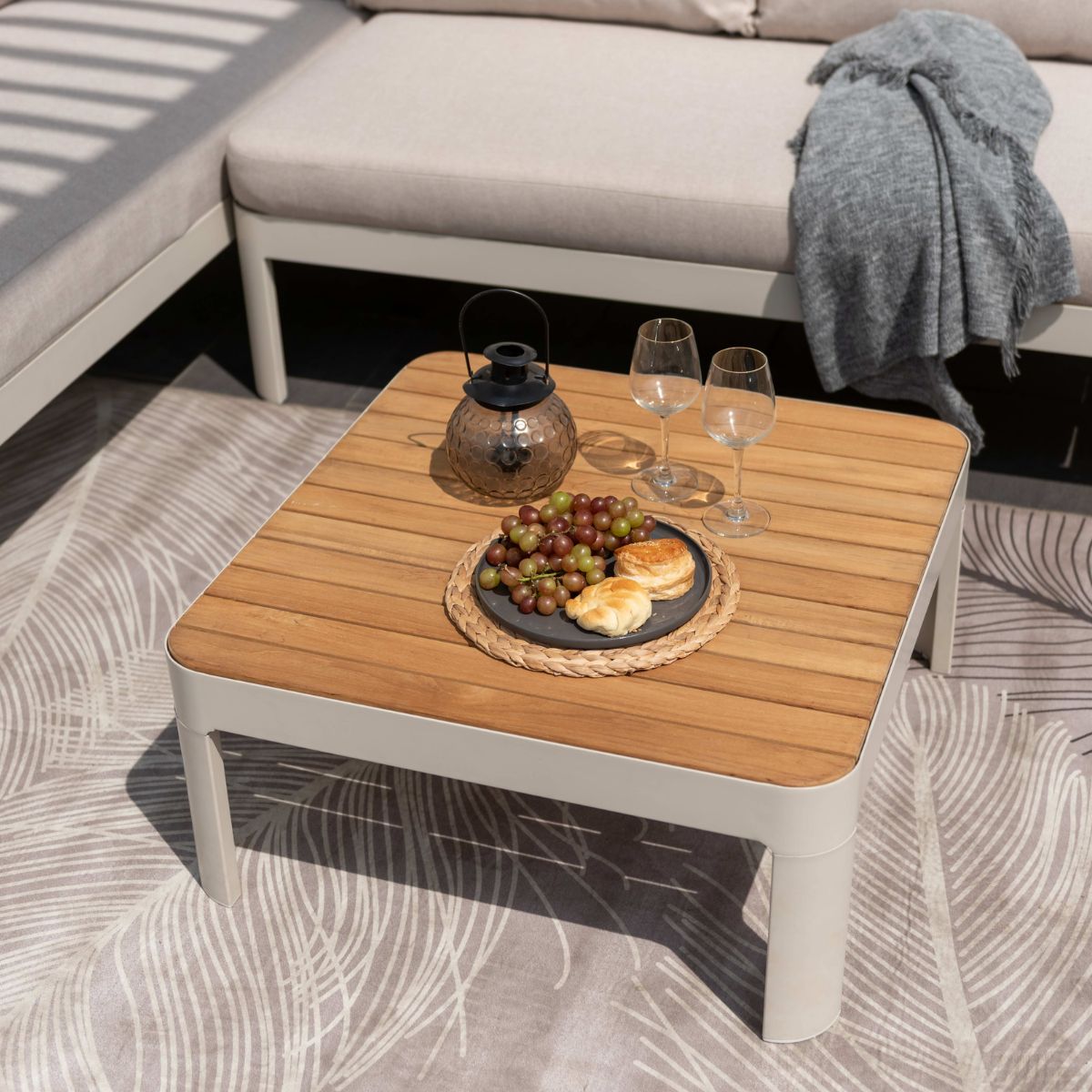 Portals Light Square Coffee Table by LifestyleGarden with wooden top; two wine glasses on Tampa Home & Garden Store