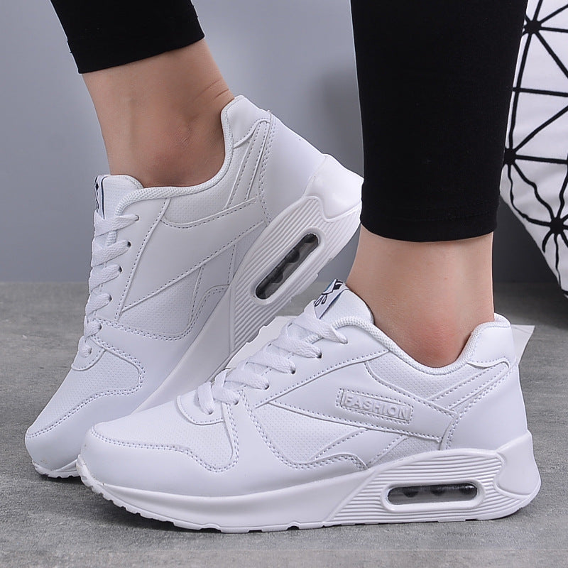 Pair of white platform sneakers with air-cushion midsole and textured upper on Tampa Home & Garden Store