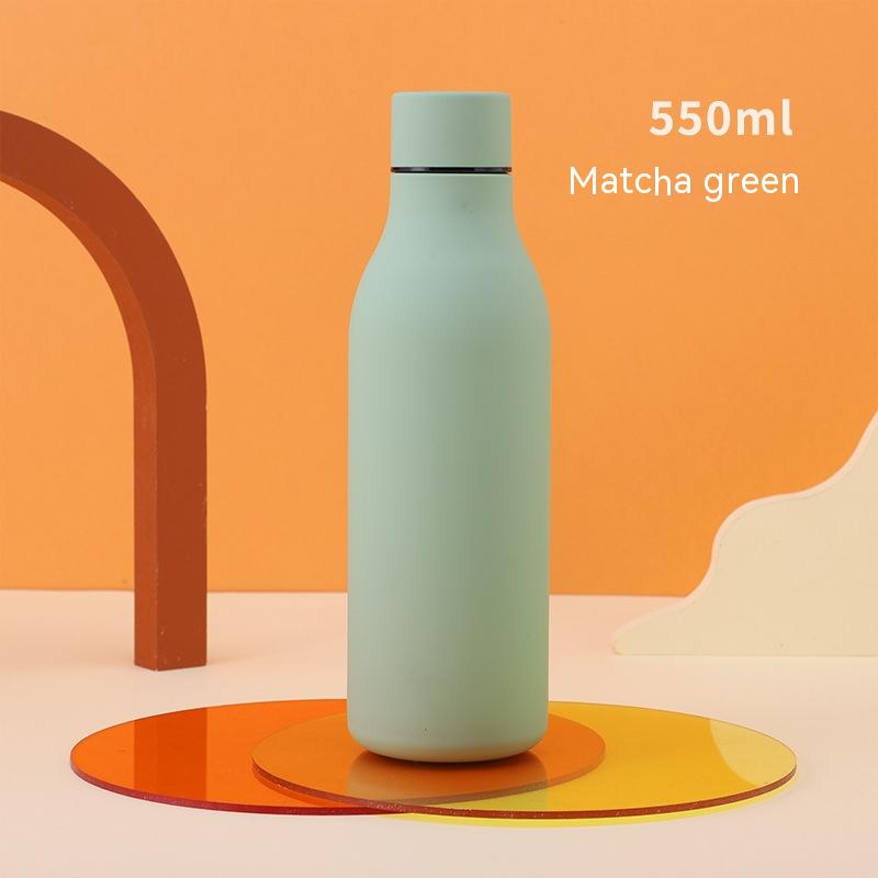 Stainless steel 550ml water bottle in matcha green with matte finish on orange backdrop on Tampa Home & Garden Store