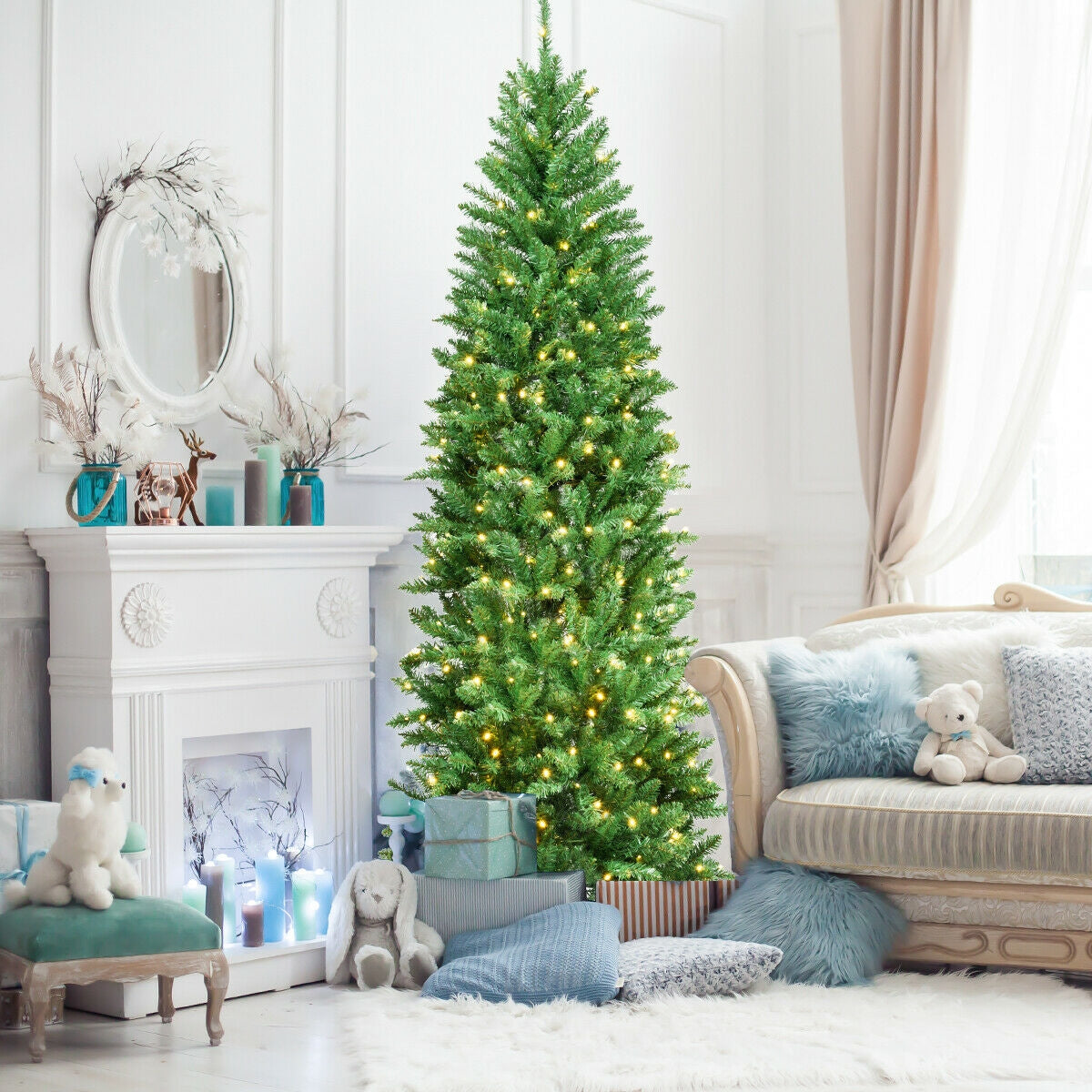 6 ft PVC hinged pre-lit artificial fir pencil tree with 150 warm lights in a living room on Tampa Home & Garden Store