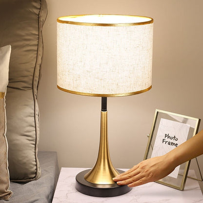 Stevvex ST125099AYL table lamp with beige fabric shade, brass-gold base, touch dimming on Tampa Home & Garden Store