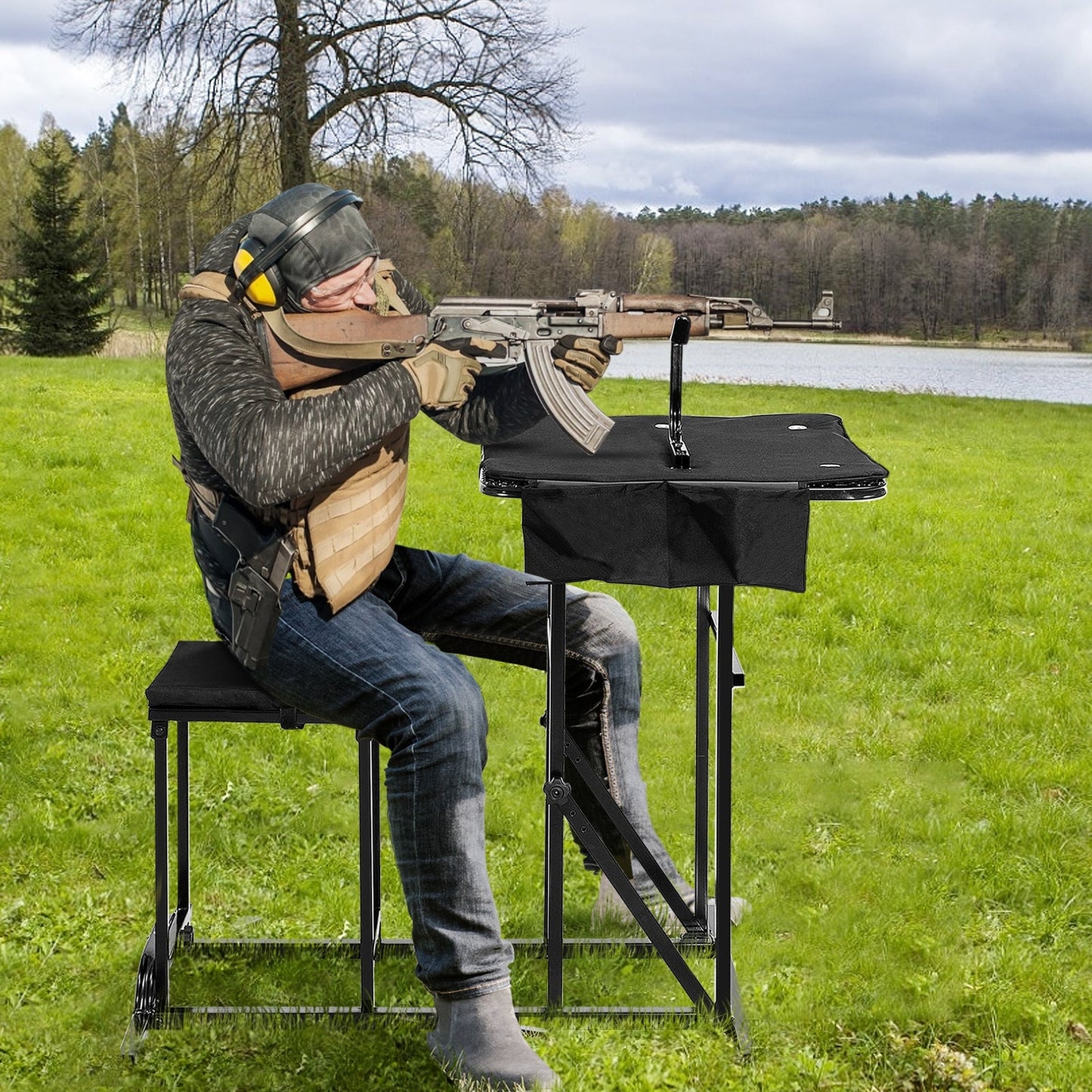 Foldable shooting bench with adjustable-height black table; shooter aims rifle outdoors on Tampa Home & Garden Store