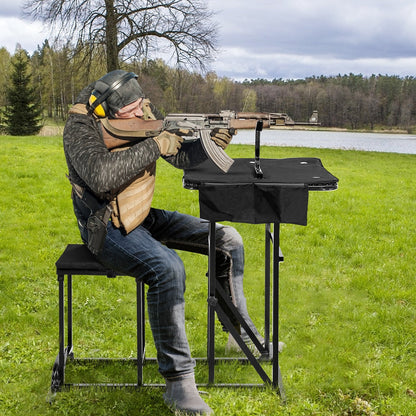 Foldable shooting bench with adjustable-height black table; shooter aims rifle outdoors on Tampa Home & Garden Store