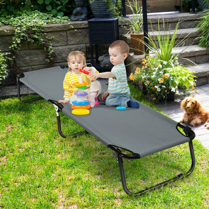 GemGear outdoor folding camping cot, black frame and gray fabric, kids playing nearby on Tampa Home & Garden Store