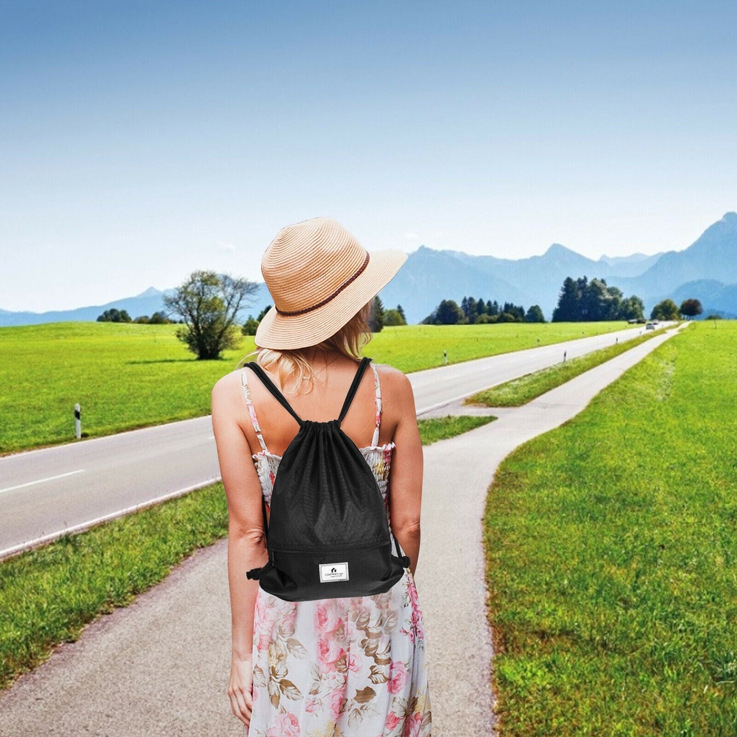Drawstring backpack GemGear in black with zip pocket worn by woman on countryside road on Tampa Home & Garden Store